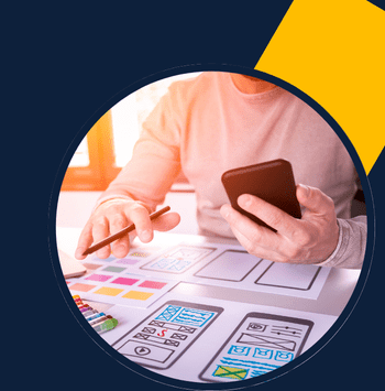 Freelance website developer sketching mobile UI design